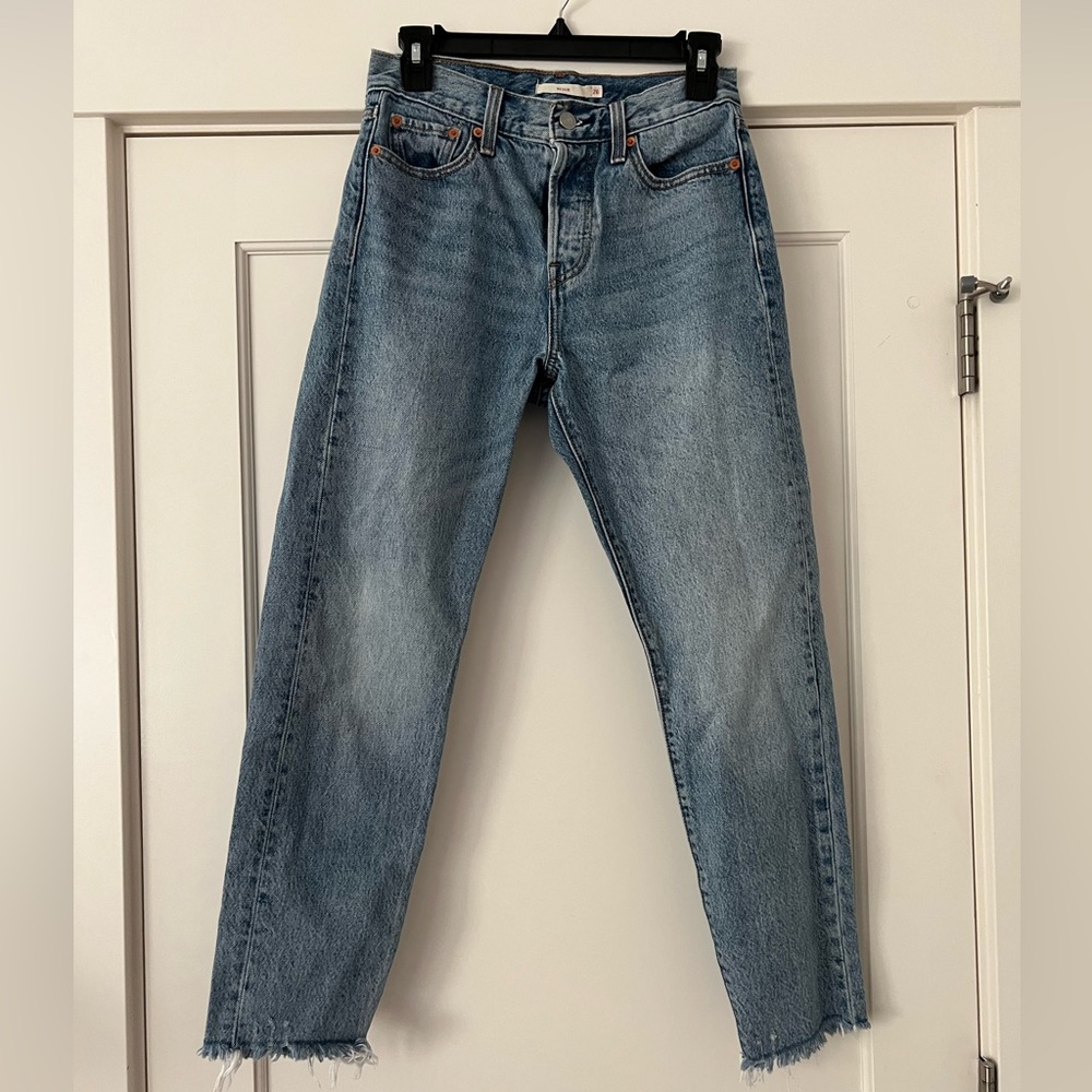 Levi’s wedgie size 26. Frayed at ankles. Worn once and washed once. Blue wash